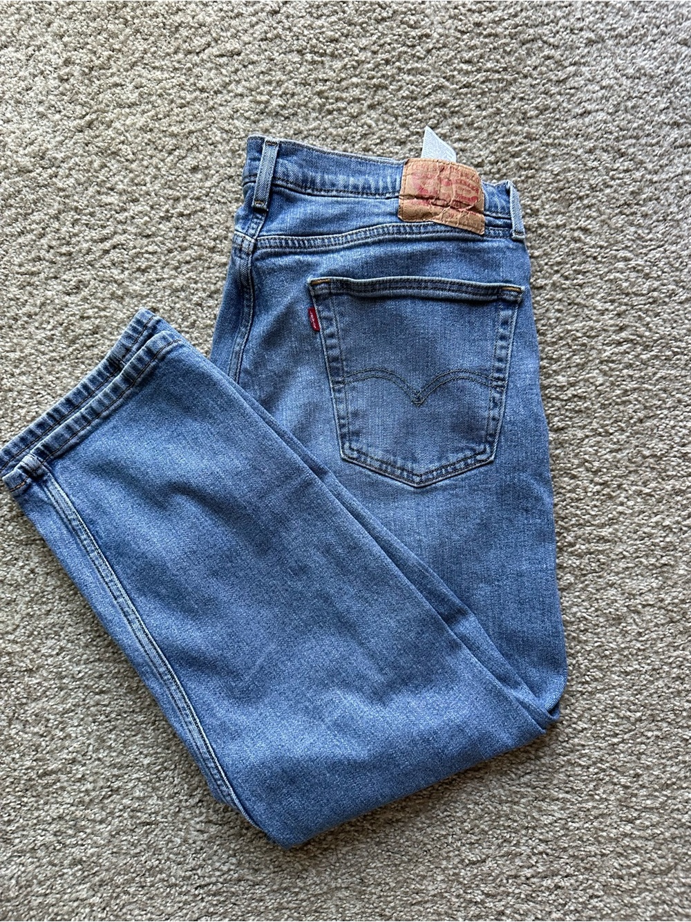 Levi's light blue denim jeans with brown leather patch